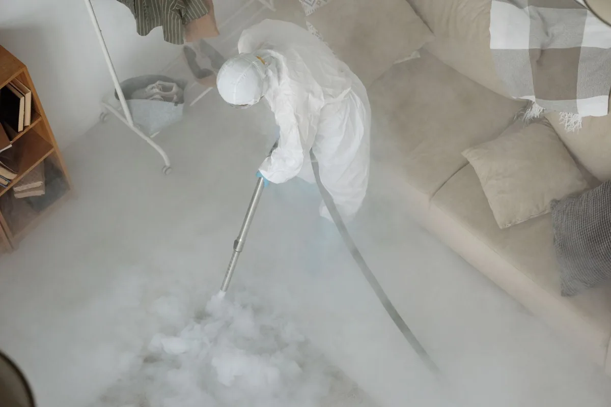 Biohazard cleanup technician in protective equipment, Rockvale, TN